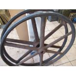 Pair of six spoke cast iron flywheels with rubber rims, D92cm