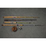 Four, two piece spinning rods, including one Bassfisher by Winfield multiplier reel, one large