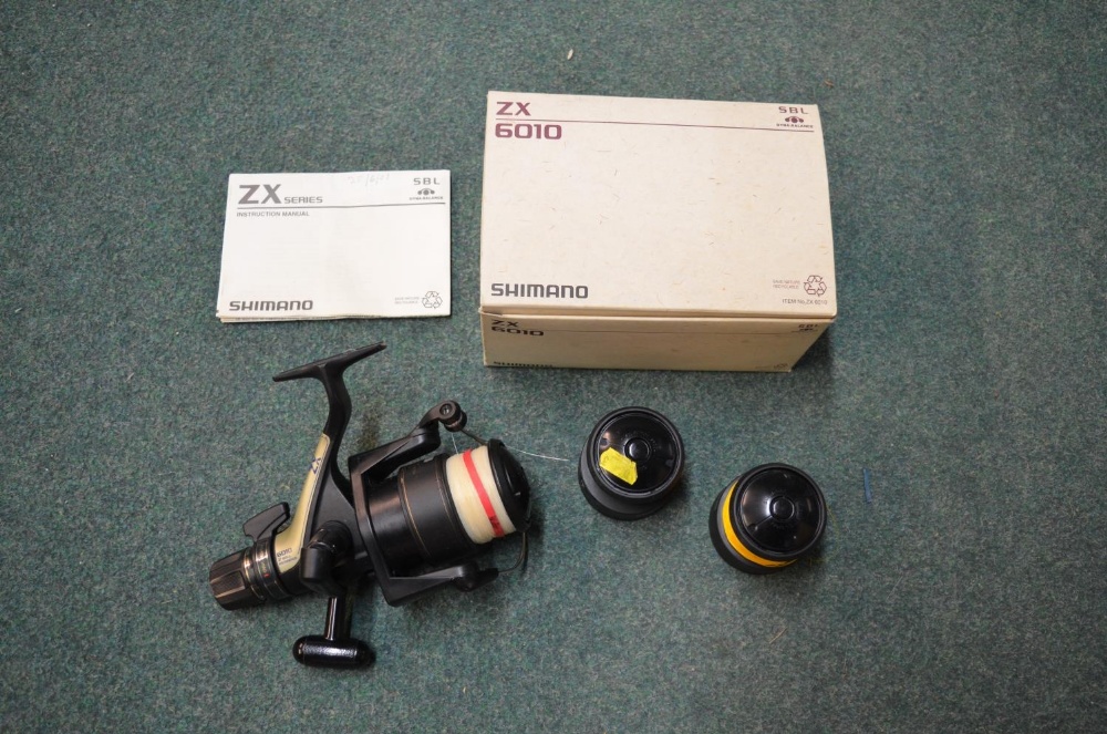 Boxed Shimano 6010ZX Baitrunner fishing reel, with two spare spools and instructions (4)