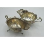 Pair of Geo.V hallmarked Sterling silver sauce boats with waived edge on pad feet by Mappin & Webb