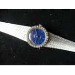 Late 1960s Ladies Omega Geneve white metal and diamond cocktail watch. Integral case and bracelet,