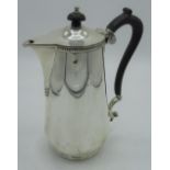 Geo.V hallmarked sterling silver coffee pot, cylindrical body with ebonised handle, by Boardman,