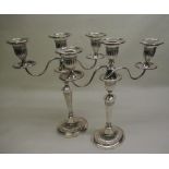 Pair of Edw.VII hallmarked Sterling silver, three-light, two branch candelabra, with lobed urn