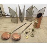 Copper coal pod, two copper and brass warming pans on turned handles, brass hob tidy, four folding