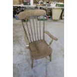 Early C20th beech stick back farm house style arm chair with H shaped under stretcher and turned