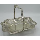 Geo.V hallmarked Sterling silver swing handled shaped rectangular basket, with pierced sides and
