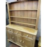 C20th Victorian style pine dresser with three open tier raised back, the base with three drawers and