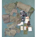 Collection of 1958 pattern British Army webbing and back packs, rolled up NBC smock and trousers,