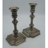 Pair of Edw.VII 17th century style candlesticks, with urn sconces on knopped column and shaped