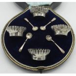 Set of four Edw.VII hallmarked Sterling silver fluted edge oval salts with spoons in fitted case
