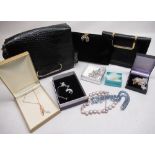 Collection of various costume jewellery and three ladies handbags, etc.