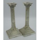 Pair of Victorian hallmarked Sterling silver Corinthian column candlesticks on stepped square