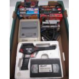 Super Nintendo entertainment system game console, with SN ProPad and Donkey Kong Country, Street