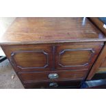 Small early C19th commode converted to a cupboard, with faux panelled door and drawer front on