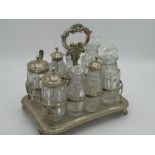 Geo.IV hallmarked Sterling silver eight bottle rectangular cruet stand with C scroll loop handle,