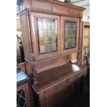 Early C20th Dutch side cabinet with moulded cornice above pair of coloured lead glazed doors with