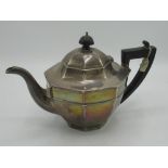 Geo.V hallmarked Sterling silver octagonal teapot with ebonised handle and finial (maker unknown),