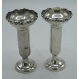 Pair of Geo.V hallmarked Sterling silver bud vases with S scroll rim on circular base, by Walker and