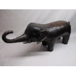 Liberty of London stitched leather footstool in the form of a trumpeting elephant, L90cm, H44cm