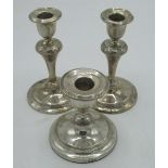 Pair of Geo.V hallmarked Sterling silver candlesticks on circular bases with turned stems, by W J