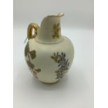 Late Victorian Royal Worcester jug, reeded gilt handle and blush ivory ground decorated with