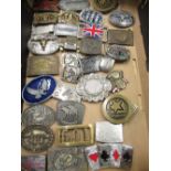 Collection of brass and other coloured enamel decorated belt buckles, including Triumph, Paul Smith,