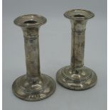 Pair of Edw.VII hallmarked Sterling silver candlesticks on circular bases, by S Blanckensee & Son