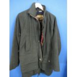 Hucklecote sporting jacket with outside pockets and handwarming pockets, zip and buttons, with