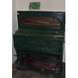 Early c20th travelling street Barrel Piano, green painted body labelled Keith Prowse & Co Ltd