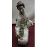 Nao model of seated Geisha arranging flowers, H36cm