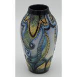 Moorcroft pottery vase c2010 in a blue and yellow colourway with a tube lined design of scrolling