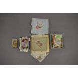 Box of cigarette cards, two embroidered handkerchiefs, US embroidered sewing bag, number of