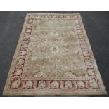 Late C20th Agra Twist wool rug, old gold ground with scrolling floral pattern centre and scroll