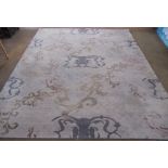 Late C20th Nepalese silk and wool handmade rug, grey ground with abstract scrolling motifs, 251cm