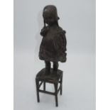 C20th bronze figure in the style of Juan Clara of young girl standing on stool, H30cm