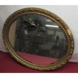 Gilt oval mirror, oval bevelled plate in gilt wood and gesso frame, W71cm H60cm