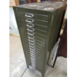 C20th green metal filing chest of twenty one drawers with chromed metal handles on angular feet,