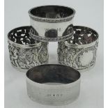 Pair of Victorian hallmarked Sterling silver napkin rings, pierced with cherubs in woodland setting,