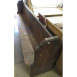 Victorian pine church pew, with panel back and solid seat on shaped end supports, W250cm D46cm H92cm