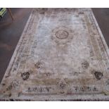 Late C20th silk style rug, beige ground with central medallion surrounded by floral pattern field