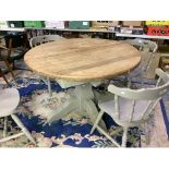 Farmhouse style circular top extending dining table in grey painted finish, and set of four chairs