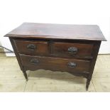 Edwardian mahogany chest of two short above one long drawer, with turned legs and casters, H77cm