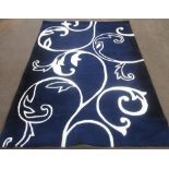 Late C20th Eden acrylic blue ground rug L230cm W160cm