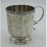 Hallmarked Sterling silver christening mug of paneled design with C scroll handle, Birmingham