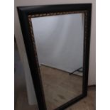 Rectangular over mantel wall mirror, ebonised and gilt leaf moulded frame, W79cm H140cm