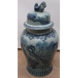 Large Chinese style decorative blue and white crackle glaze baluster vase, domed cover with dog