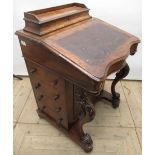 Victorian figured walnut Davenport, hinged stationary compartment and serpentine front with four