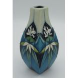 Moorcroft pottery small vase in tube lined white flower pattern of blue green background, H13cm
