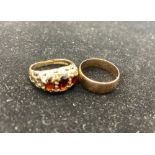 Hallmarked 9ct yellow gold ring with three gradated oval cut garnets in pierced decorative mount, by