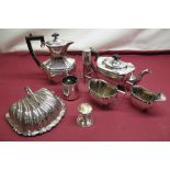 Early C20th EPNS four piece tea service with ebonised handles and finials, an EPNS shell shaped dish
